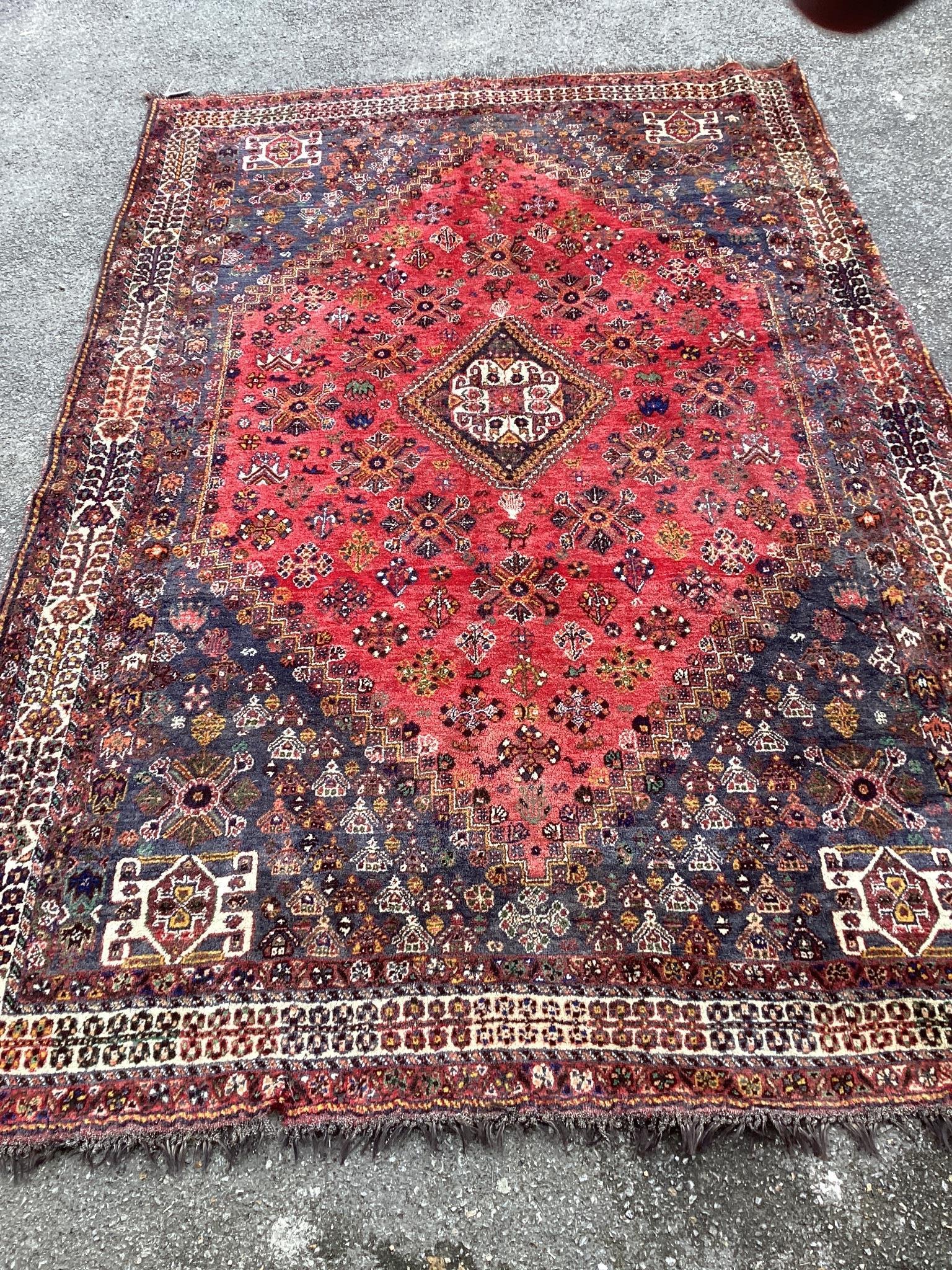 A Hamadan red ground carpet, 290 x 182cm